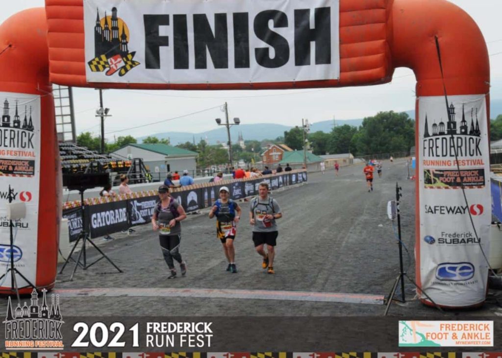Eileen and Hubby crossing finish line
