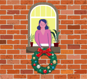 woman hanging wreath on house